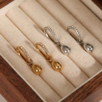 Load image into Gallery viewer, PAVE DRIP HUGGIE HOOPS
